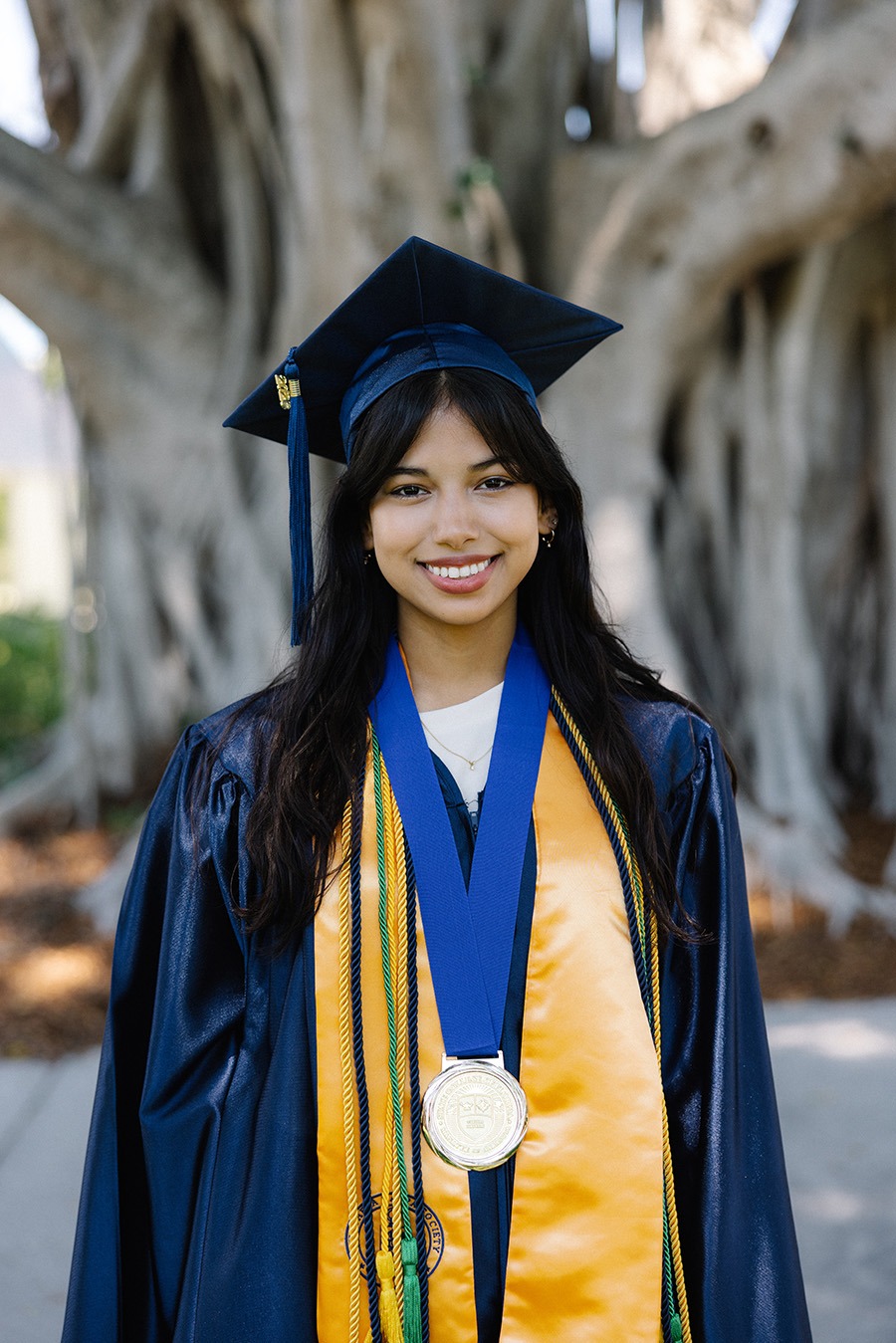Kristen Joanna Molina Medina, SCF Graduate, in her graduation regalia. 